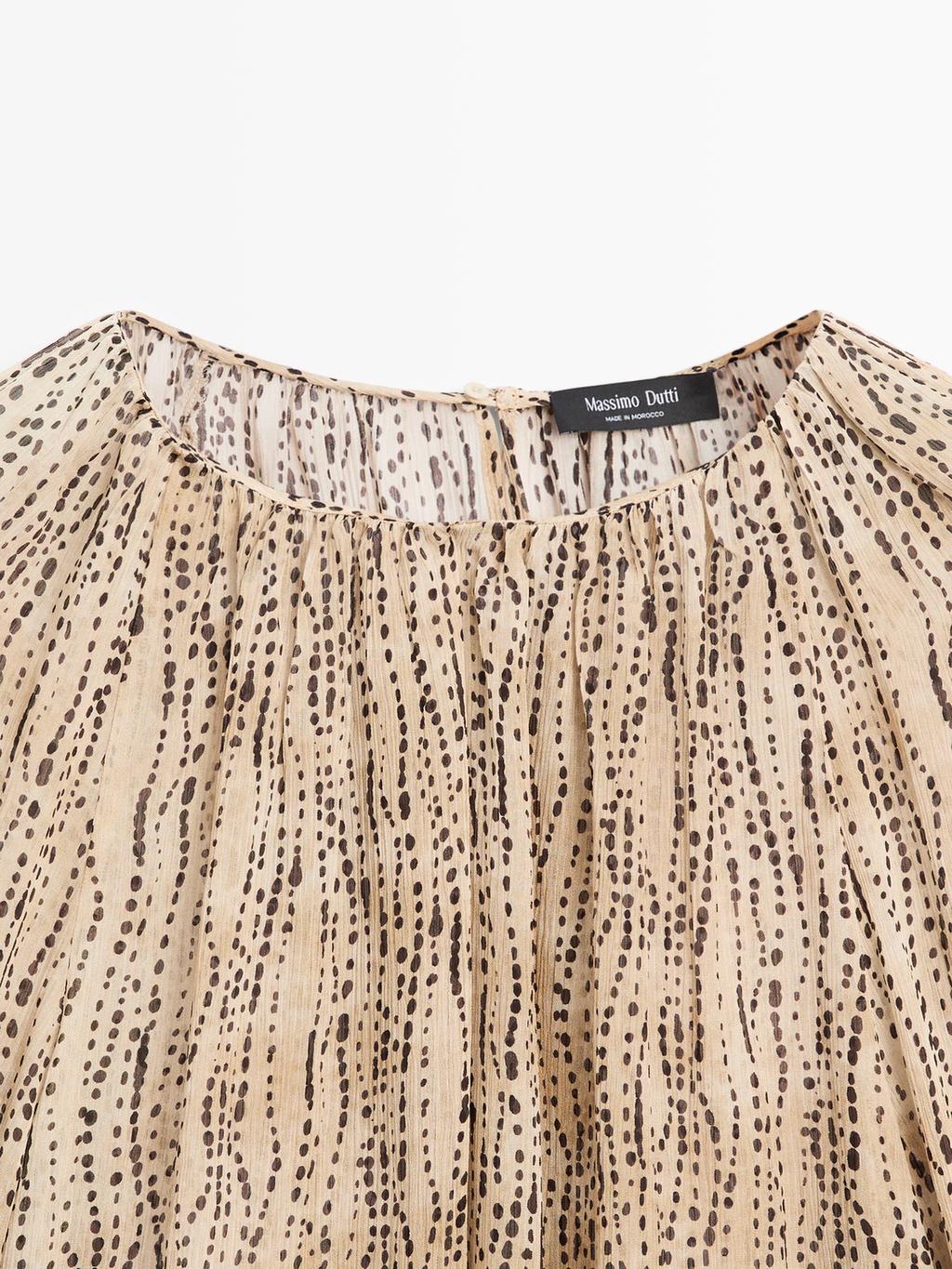 Semi-sheer draped blouse