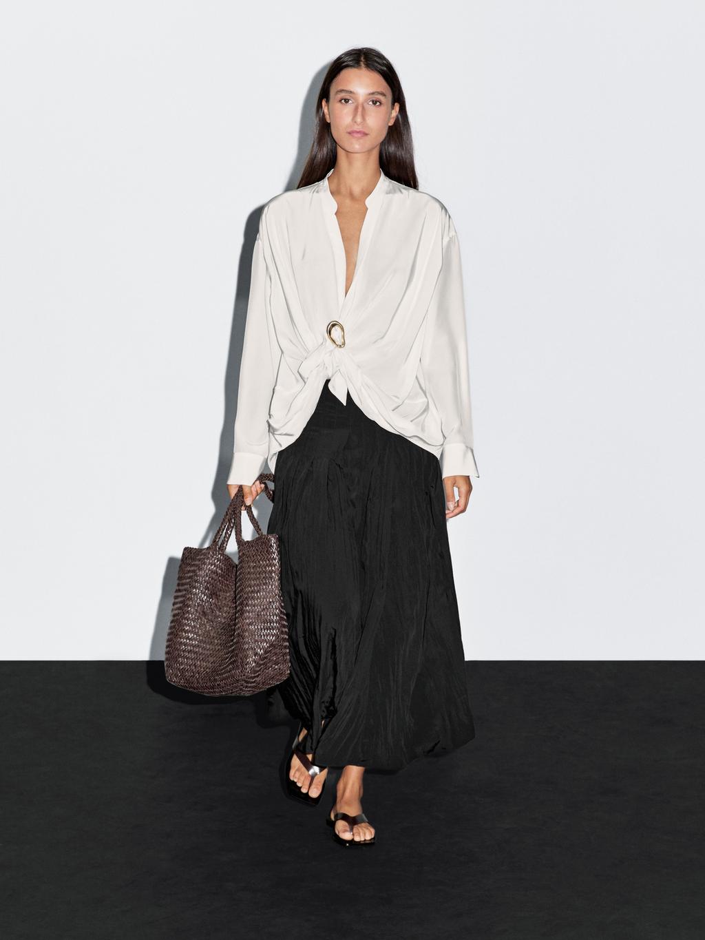 Blouse with knotted neckline and brooch detail