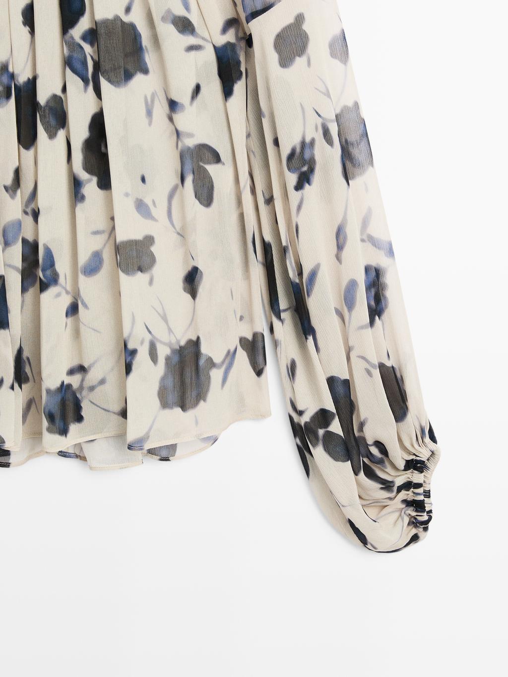 Asymmetric flowing floral print blouse