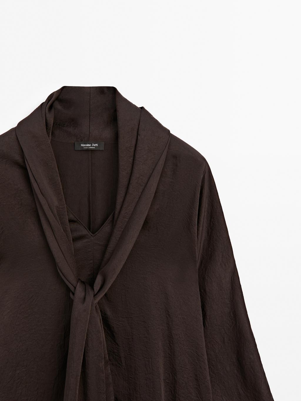 Long flowing blouse with tied neck