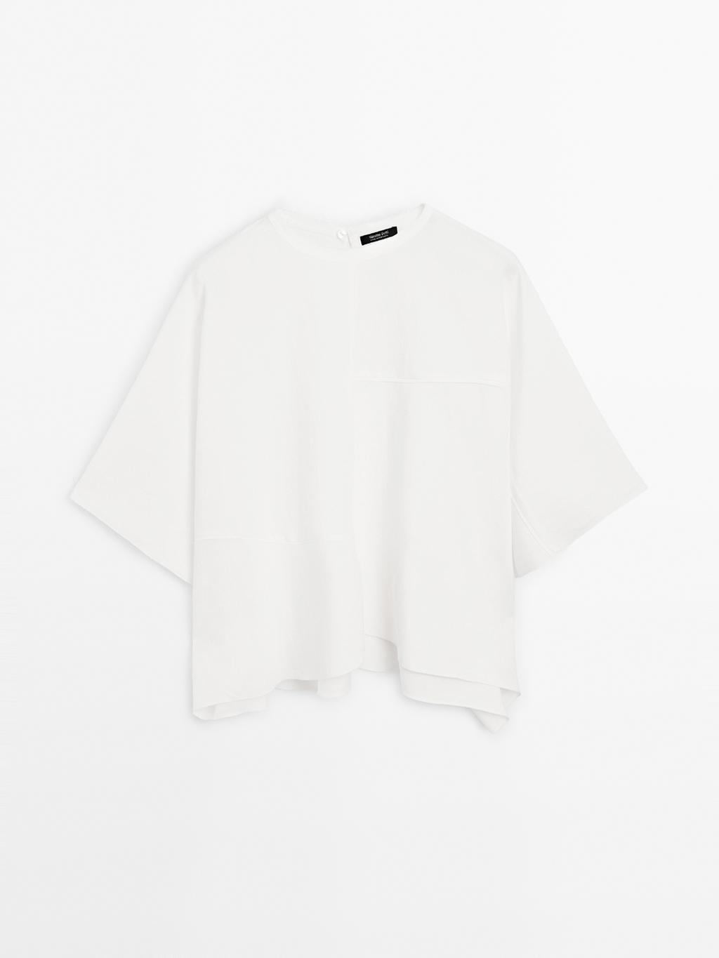 Short cape with seam details