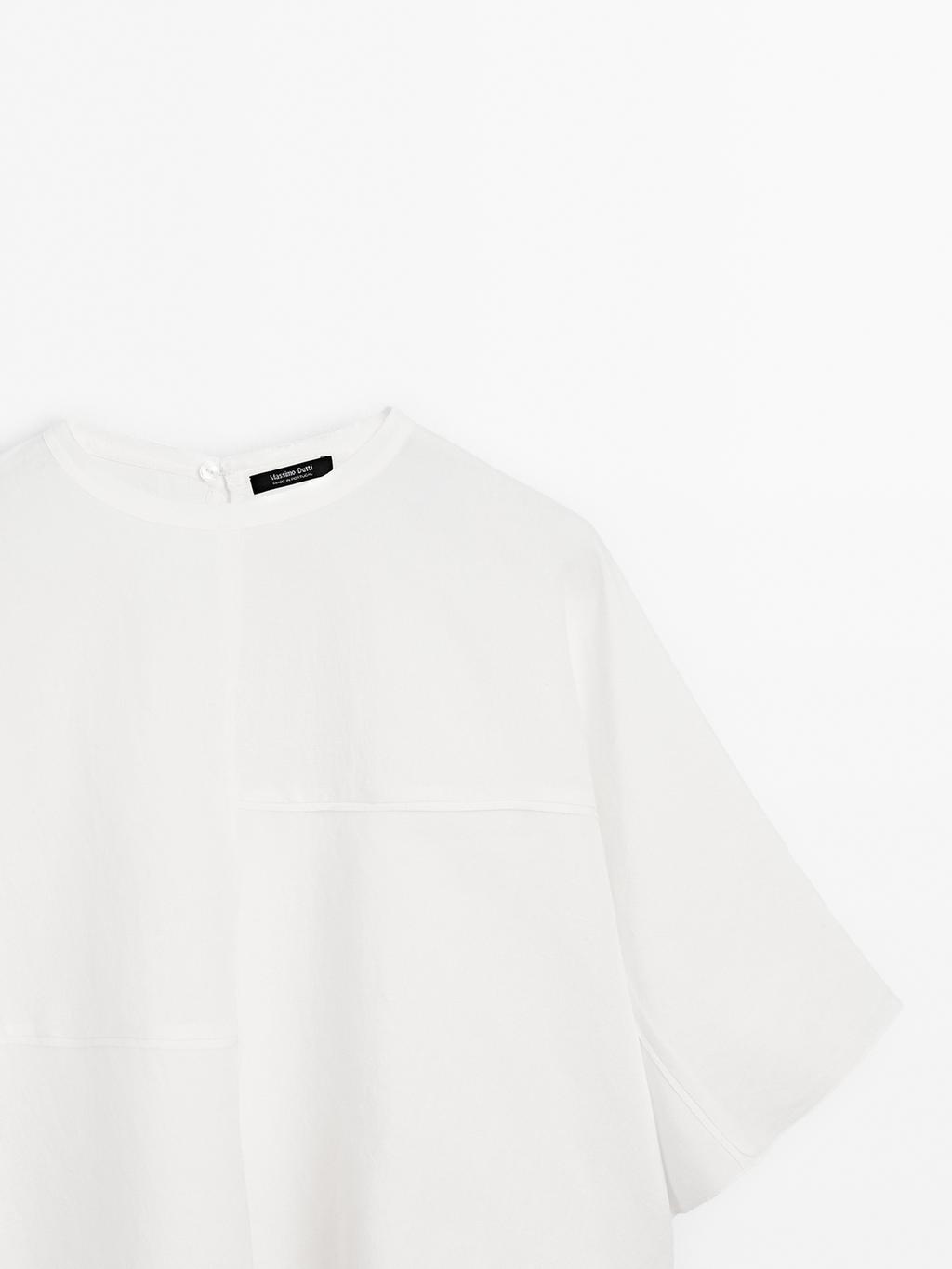 Short cape with seam details