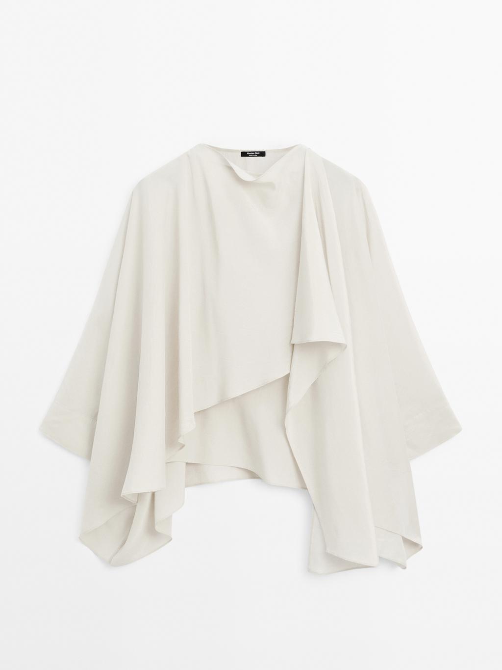 Short flowing cape with sleeve detail