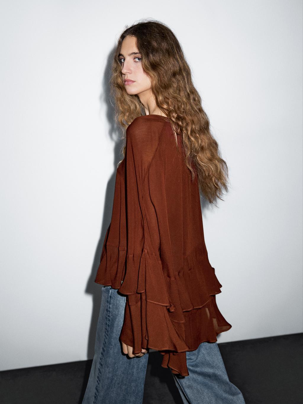 Cape-style blouse with ruffles