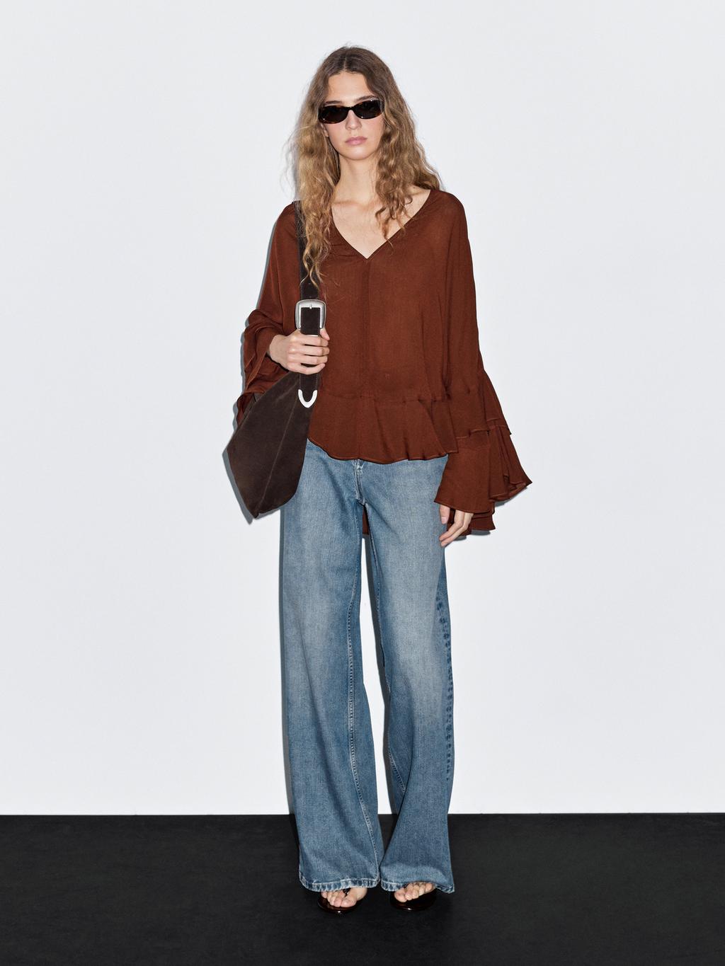 Cape-style blouse with ruffles