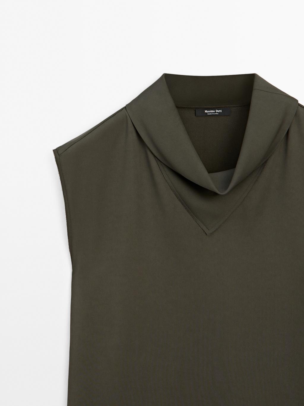 Flowing blouse with draped neck detail