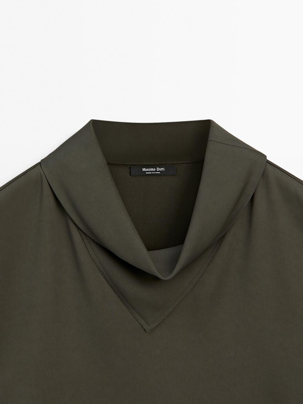 Flowing blouse with draped neck detail