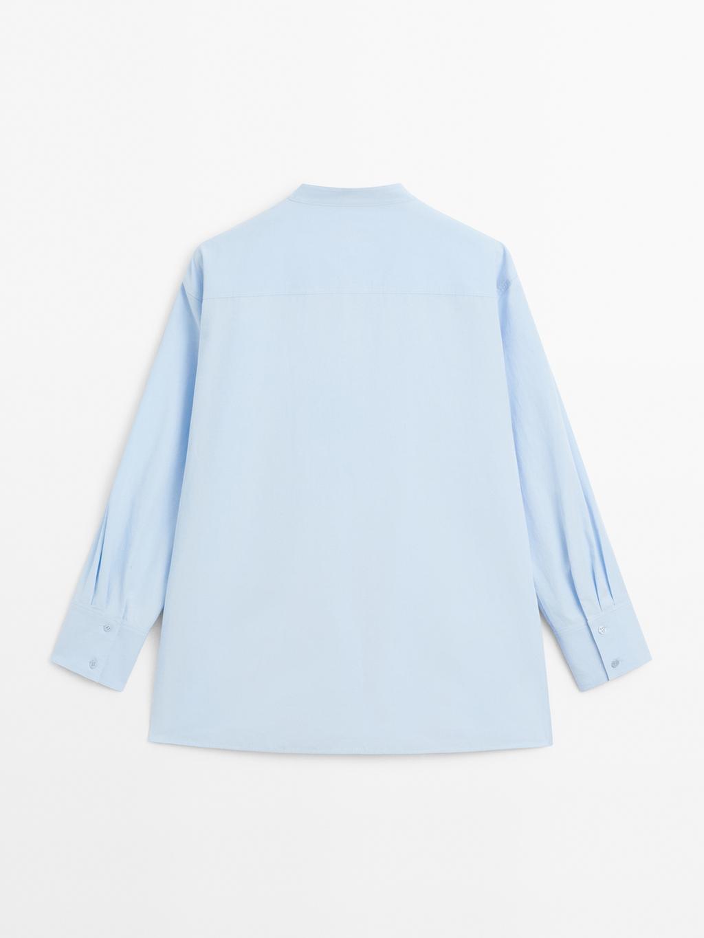 Shirt with stand collar and bib