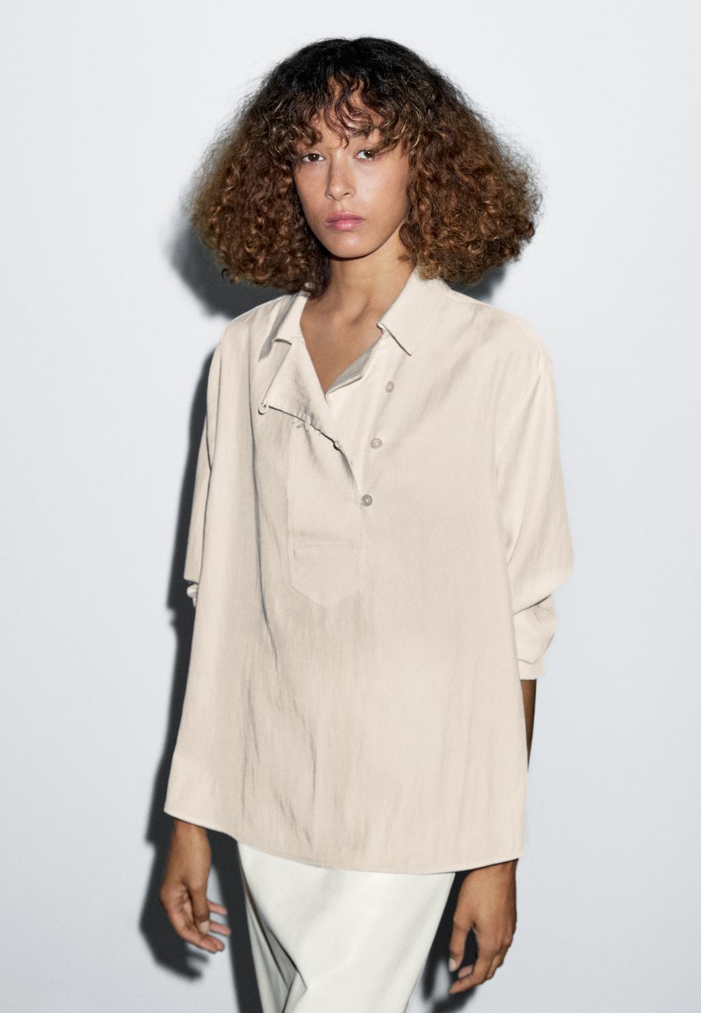 Flowing blouse with button detail