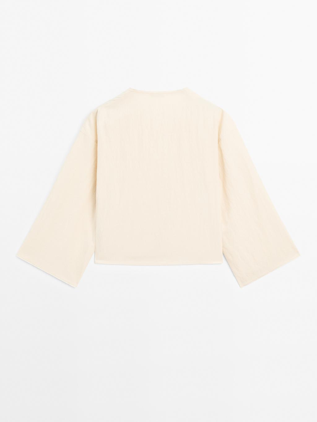 Long sleeve blouse with side button fastening