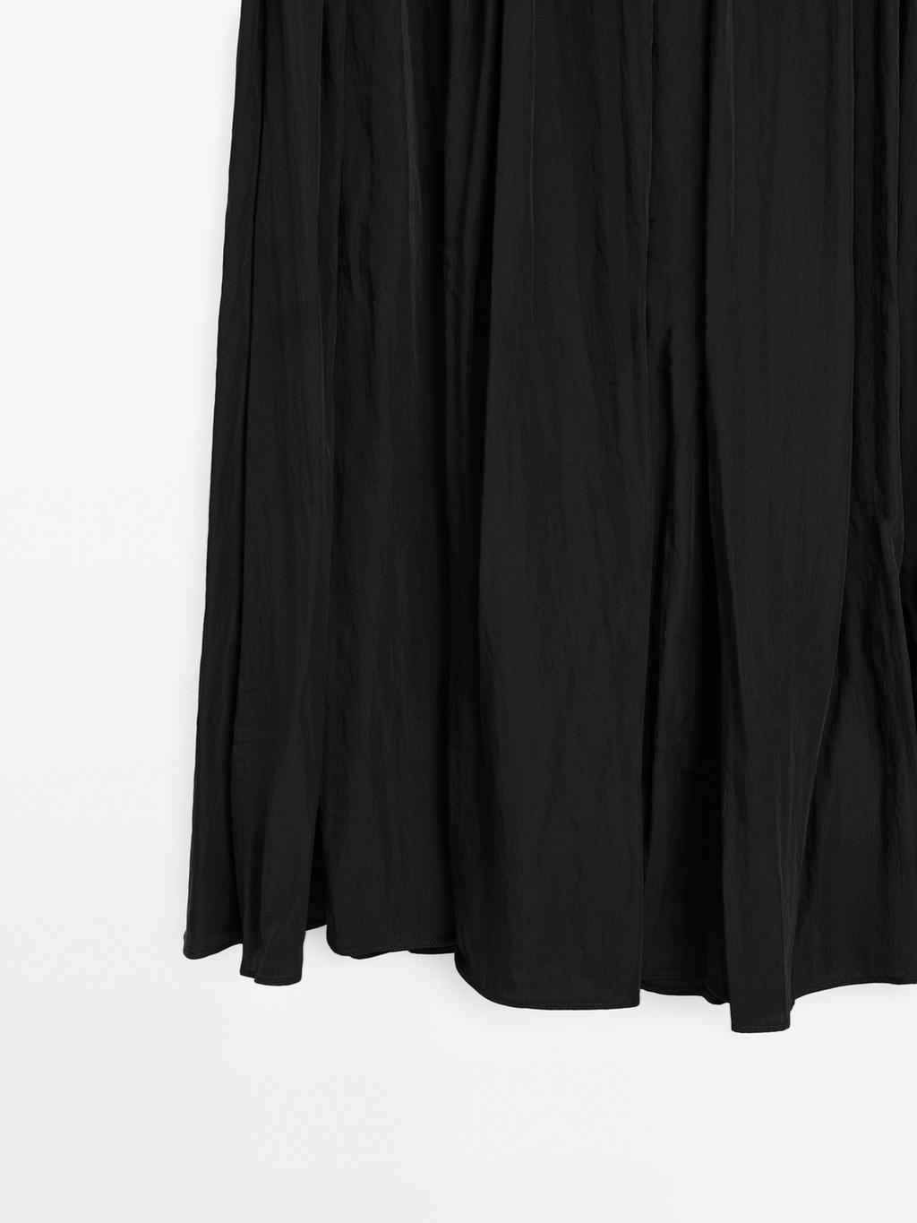 Flowing midi skirt with box pleats