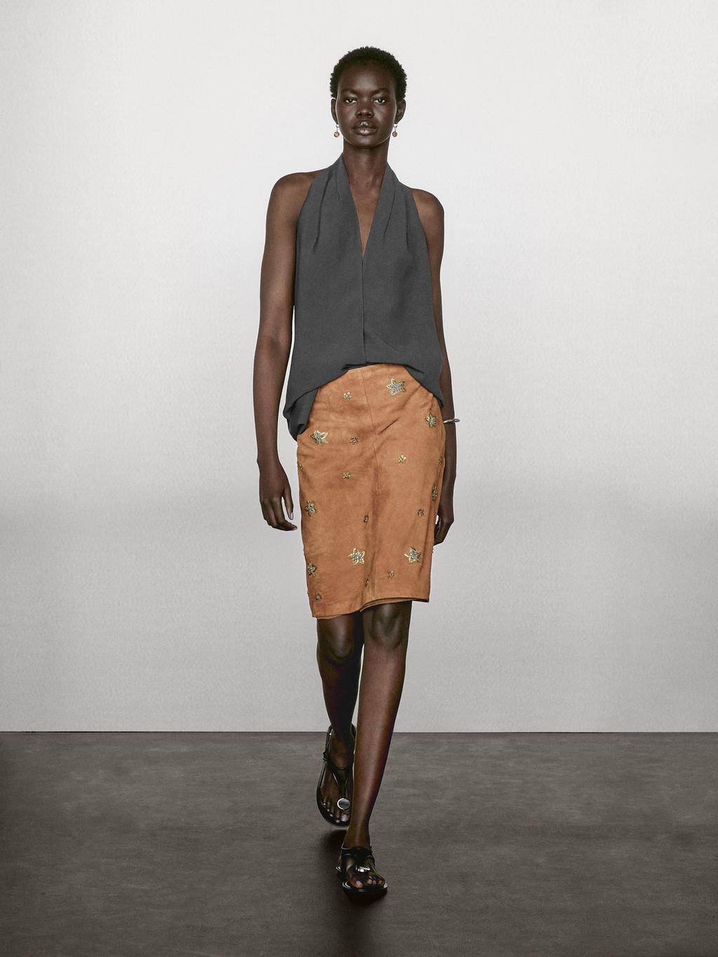 Suede leather skirt with rhinestone detail