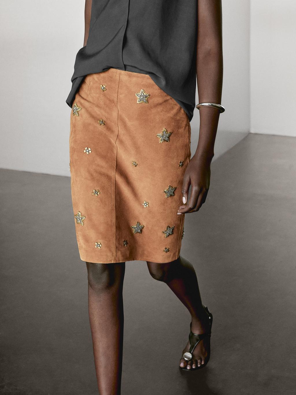 Suede leather skirt with rhinestone detail