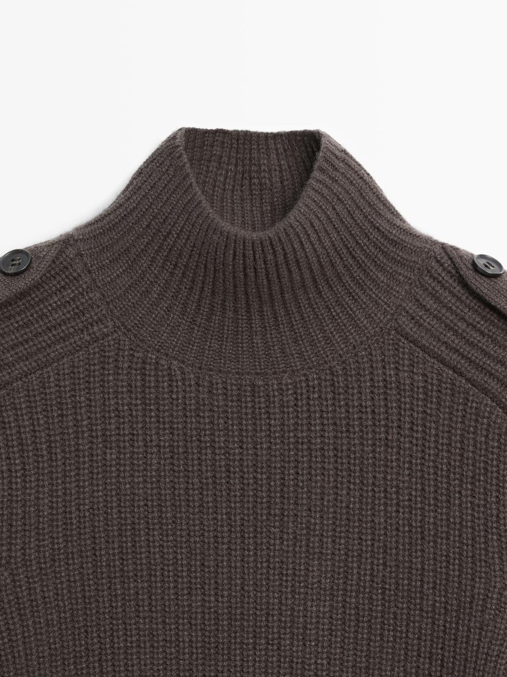 Knit sweater with shoulder detail