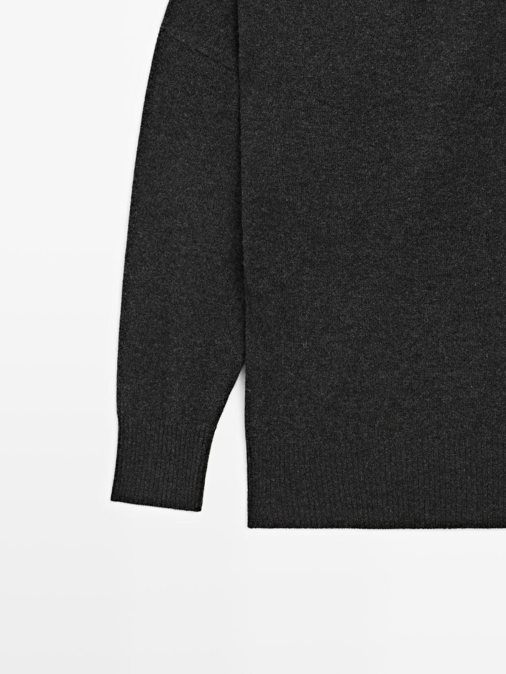 Wool blend knit sweater with asymmetric neckline