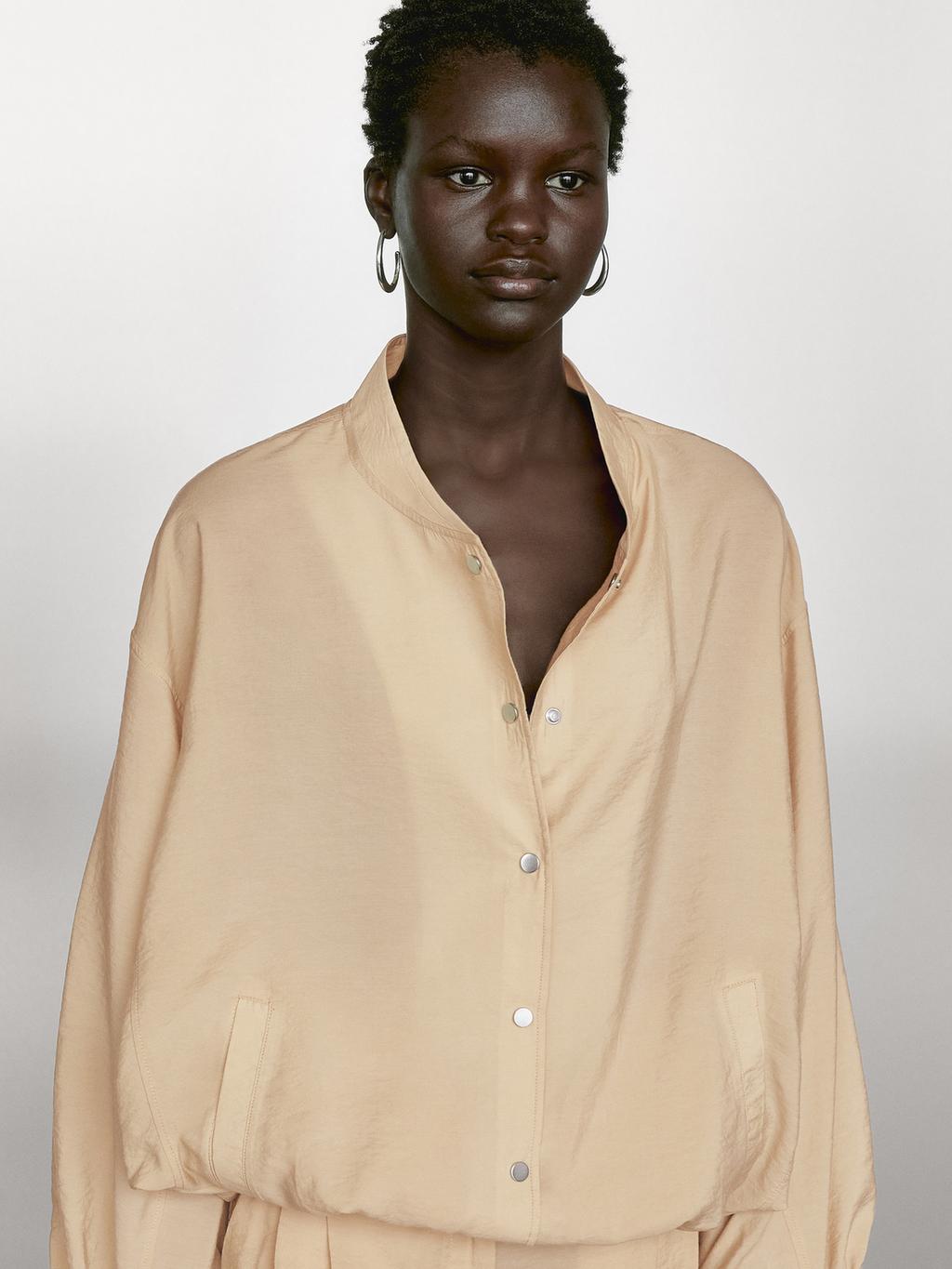 Loose-fitting bomber jacket with drawstring detail