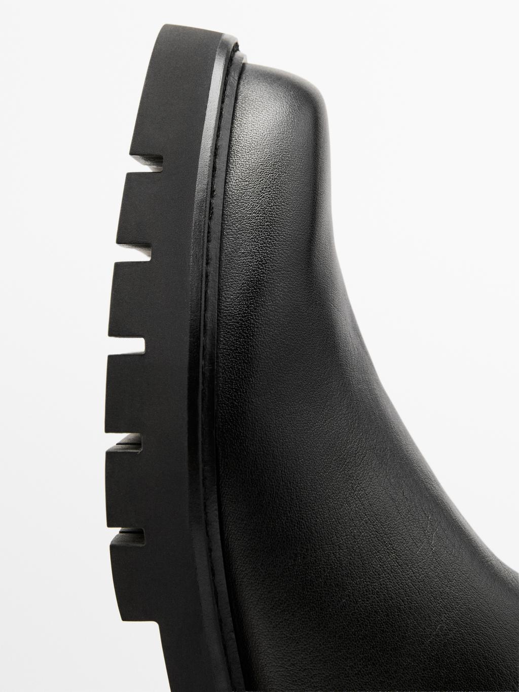 Track sole flat ankle boots